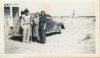 Here is a picture of R.C. Blair, his wife, and daughter, Bernadine Bishop, at the company guard shack. You will notice a mine headframe in the background. — in Boron, California.